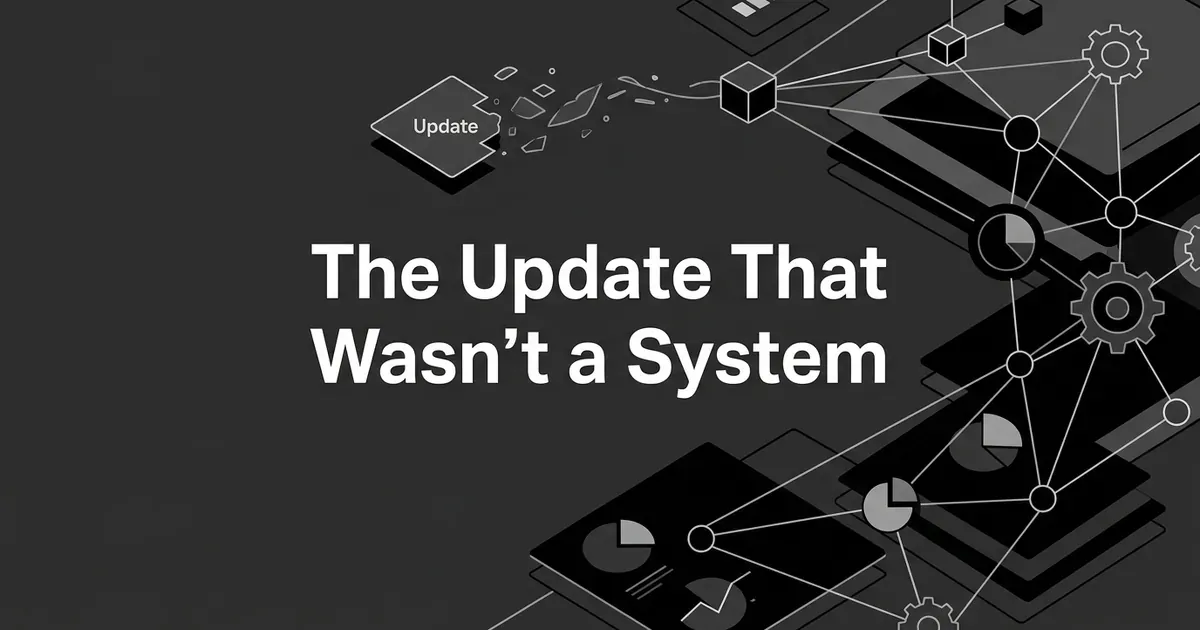 Abstract monochrome illustration of a labeled "Update" tile breaking apart and dissolving into a larger connected network of nodes, gears, and chart fragments, with the headline The Update That Wasn't a System centered over a charcoal background.